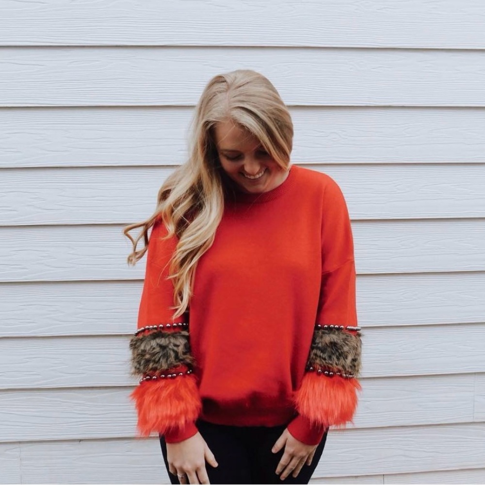 red animal print beaded sweater